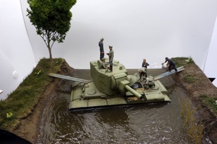 Finally, for show and tell, visitor Modeler Chris had this diorama featuring a Russian tank in trouble, with some hijinks on the side.
